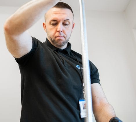 Engineer carrying out water treatment system maintenance